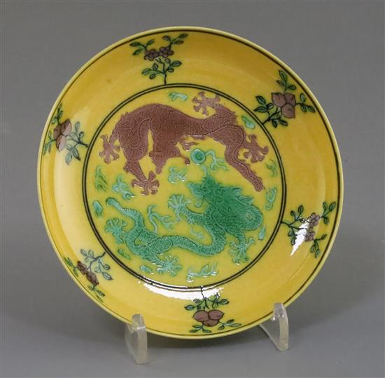 A Chinese yellow ground green and aubergine enamelled dragon dish, Guangxu mark and possibly of the period, D. 11cm